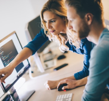 people looking at desktop computer